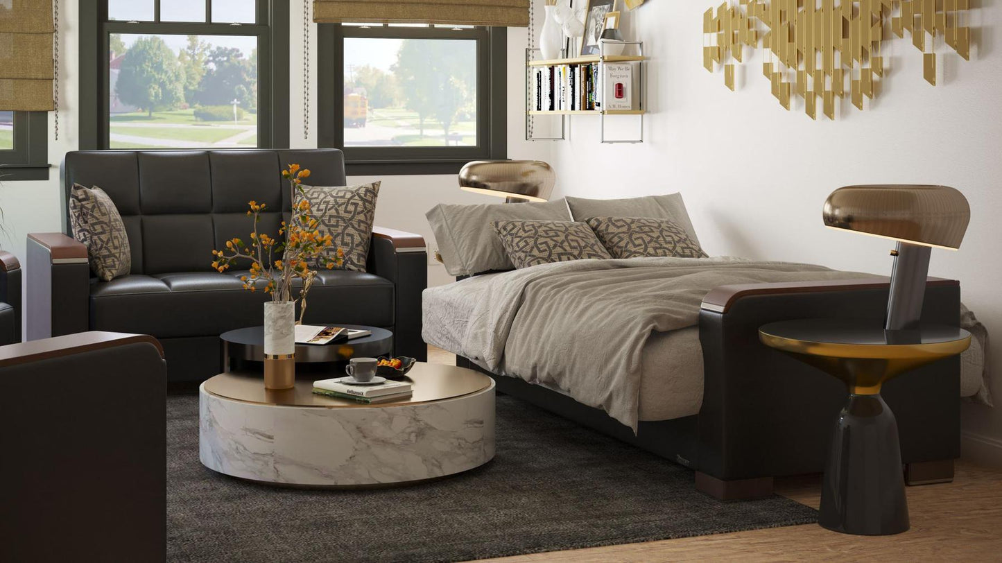 Modern design, Black , Artificial Leather upholstered convertible sleeper Loveseat with underseat storage from Voyage Luxe by Ottomanson in living room lifestyle setting converted to sleeper. This Loveseat measures 67 inches width by 36 inches depth by 41 inches height.