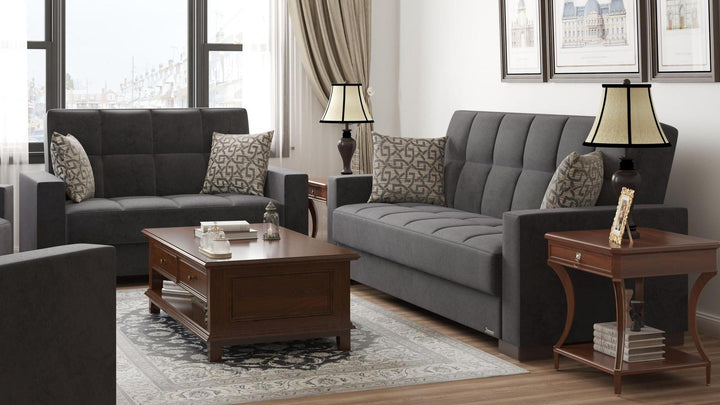 Modern design, Black , Microfiber upholstered convertible sleeper Loveseat with underseat storage from Voyage Track by Ottomanson in living room lifestyle setting with another piece of furniture. This Loveseat measures 67 inches width by 36 inches depth by 41 inches height.