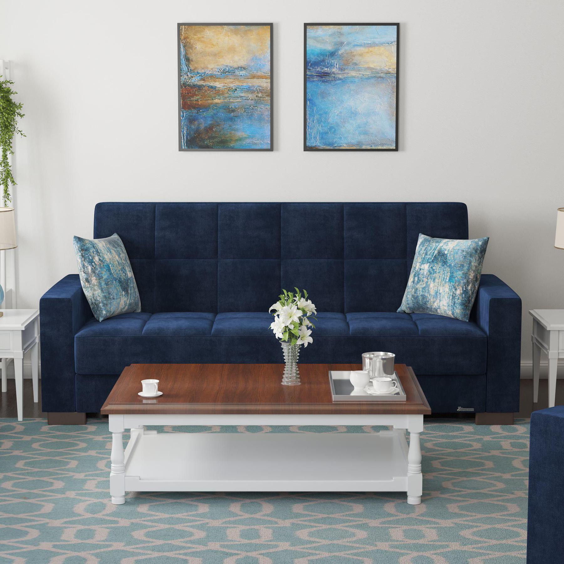 Modern design, True Blue , Microfiber upholstered convertible sleeper Sofabed with underseat storage from Voyage Track by Ottomanson in living room lifestyle setting by itself. This Sofabed measures 90 inches width by 36 inches depth by 41 inches height.