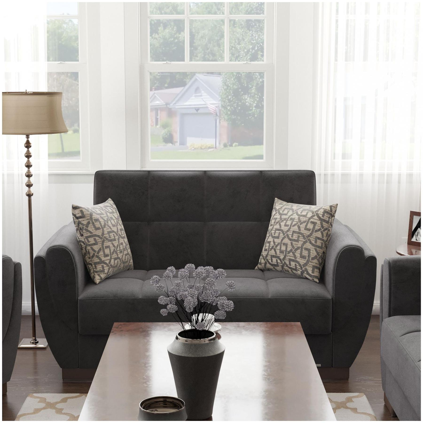 Modern design, Black , Microfiber upholstered convertible sleeper Loveseat with underseat storage from Voyage Shelter by Ottomanson in living room lifestyle setting by itself. This Loveseat measures 71 inches width by 36 inches depth by 41 inches height.