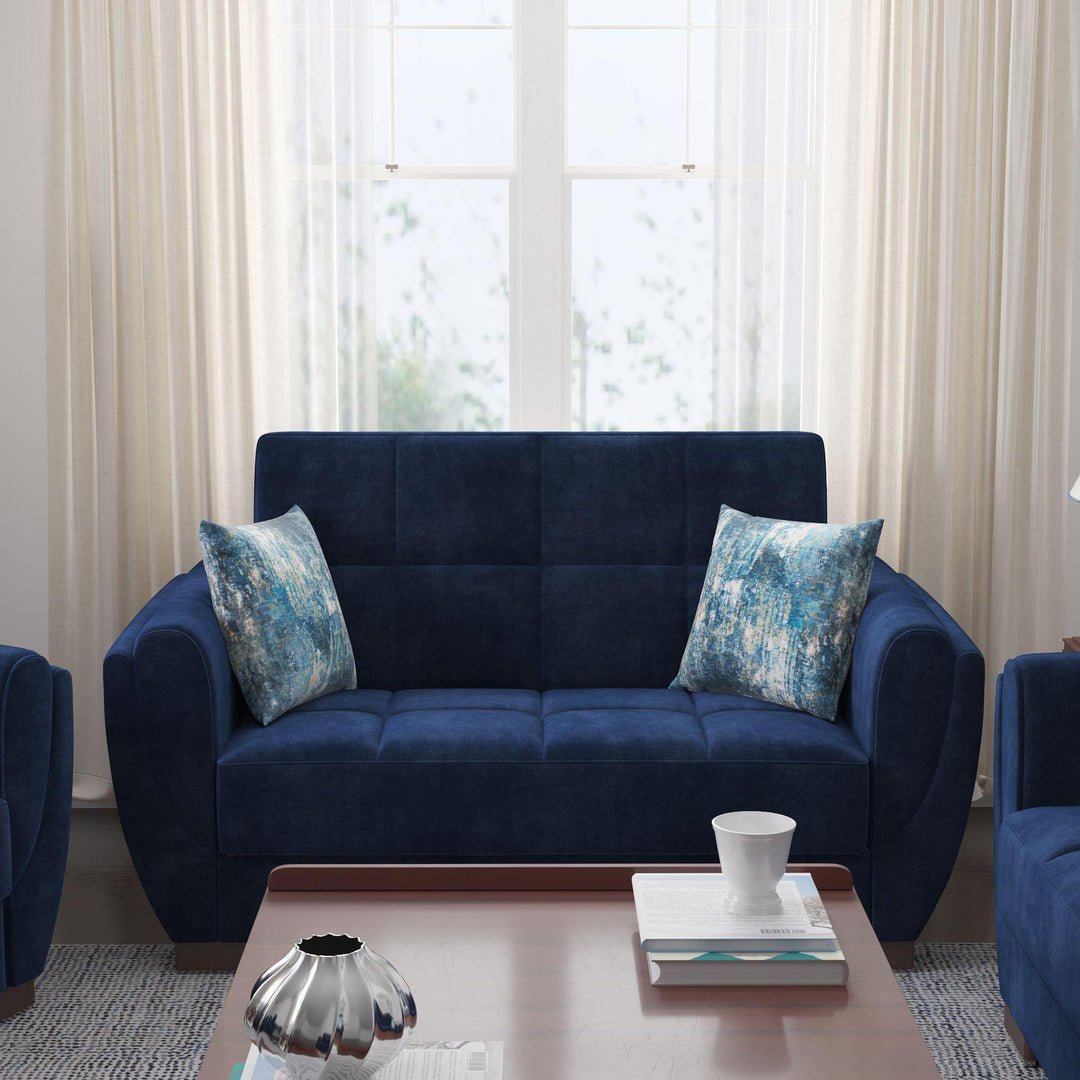 Modern design, True Blue , Microfiber upholstered convertible sleeper Loveseat with underseat storage from Voyage Shelter by Ottomanson in living room lifestyle setting by itself. This Loveseat measures 71 inches width by 36 inches depth by 41 inches height.