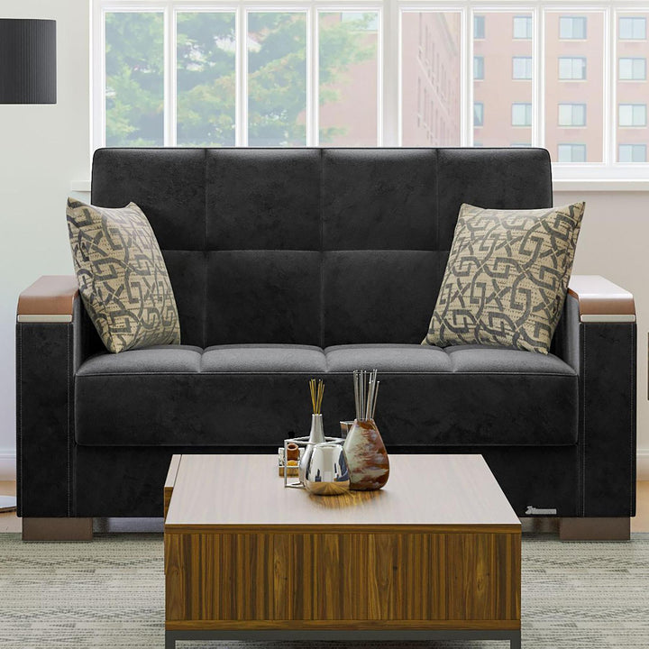 Modern design, Black , Microfiber upholstered convertible sleeper Loveseat with underseat storage from Voyage Luxe by Ottomanson in living room lifestyle setting by itself. This Loveseat measures 67 inches width by 36 inches depth by 41 inches height.