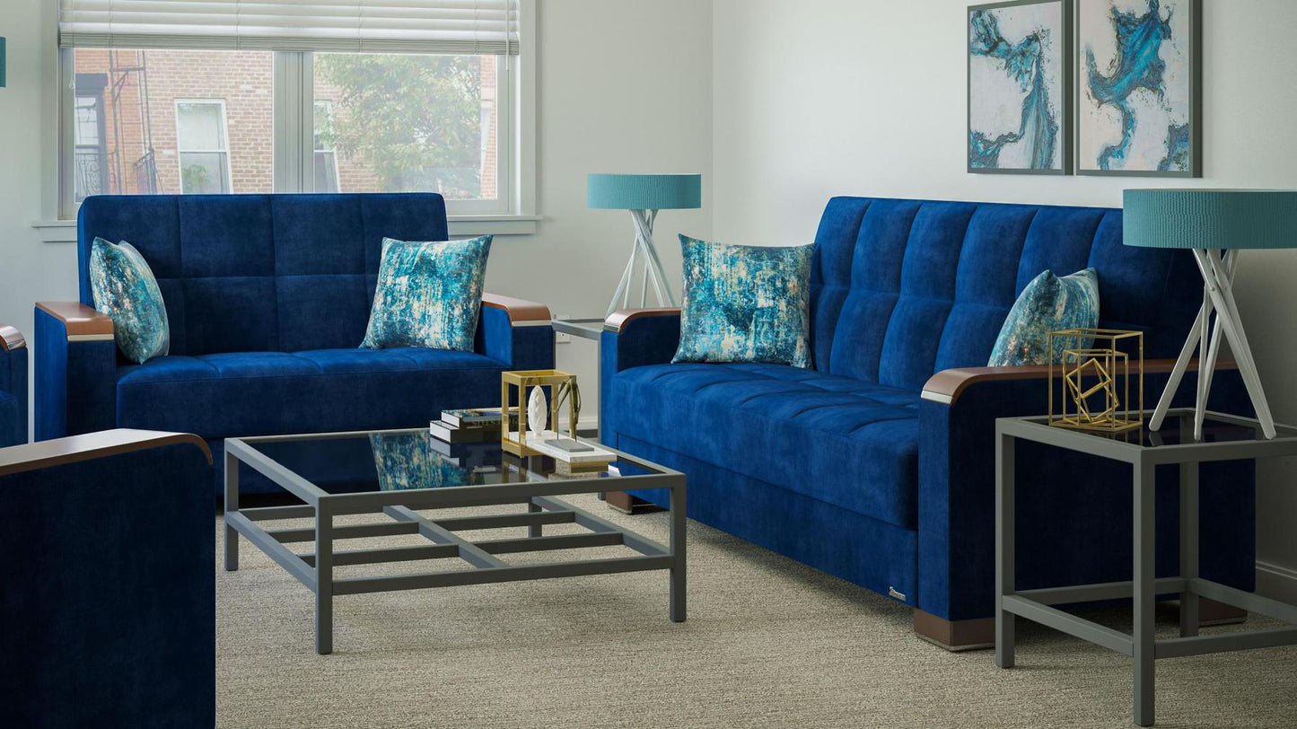 Modern design, True Blue , Microfiber upholstered convertible sleeper Loveseat with underseat storage from Voyage Luxe by Ottomanson in living room lifestyle setting with another piece of furniture. This Loveseat measures 67 inches width by 36 inches depth by 41 inches height.