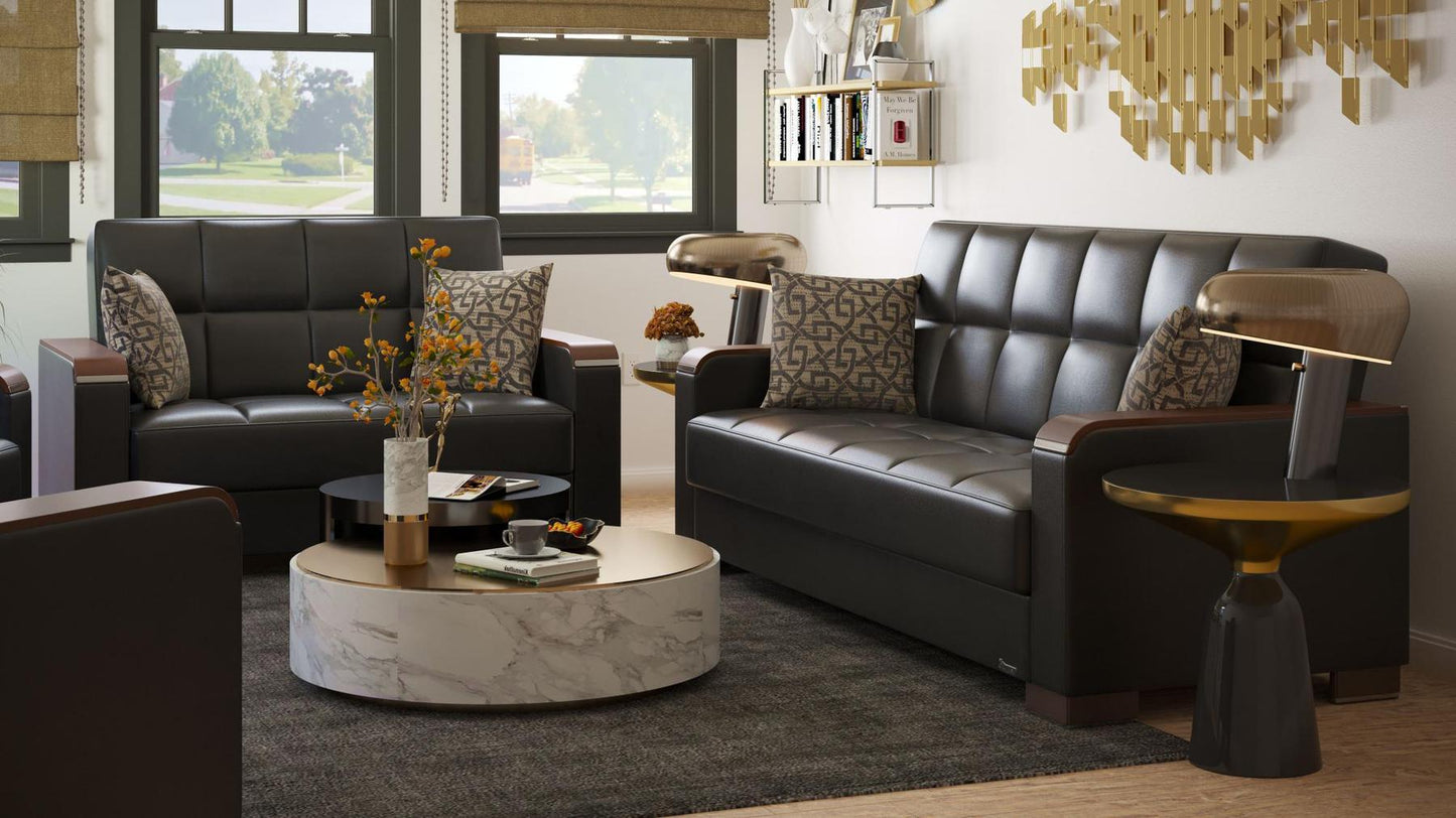 Modern design, Black , Artificial Leather upholstered convertible sleeper Loveseat with underseat storage from Voyage Luxe by Ottomanson in living room lifestyle setting with another piece of furniture. This Loveseat measures 67 inches width by 36 inches depth by 41 inches height.