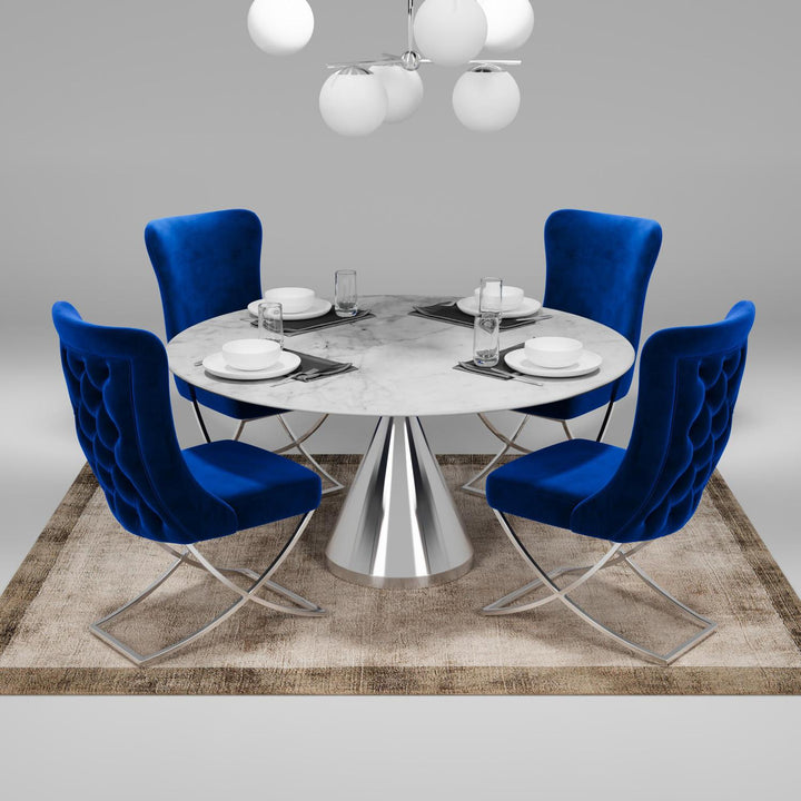 Sultan Wing Back , Modern design, upholstered dining chair in Imperial Blue with Silver Metal legs in a dining room with set of four chairs around a round table.